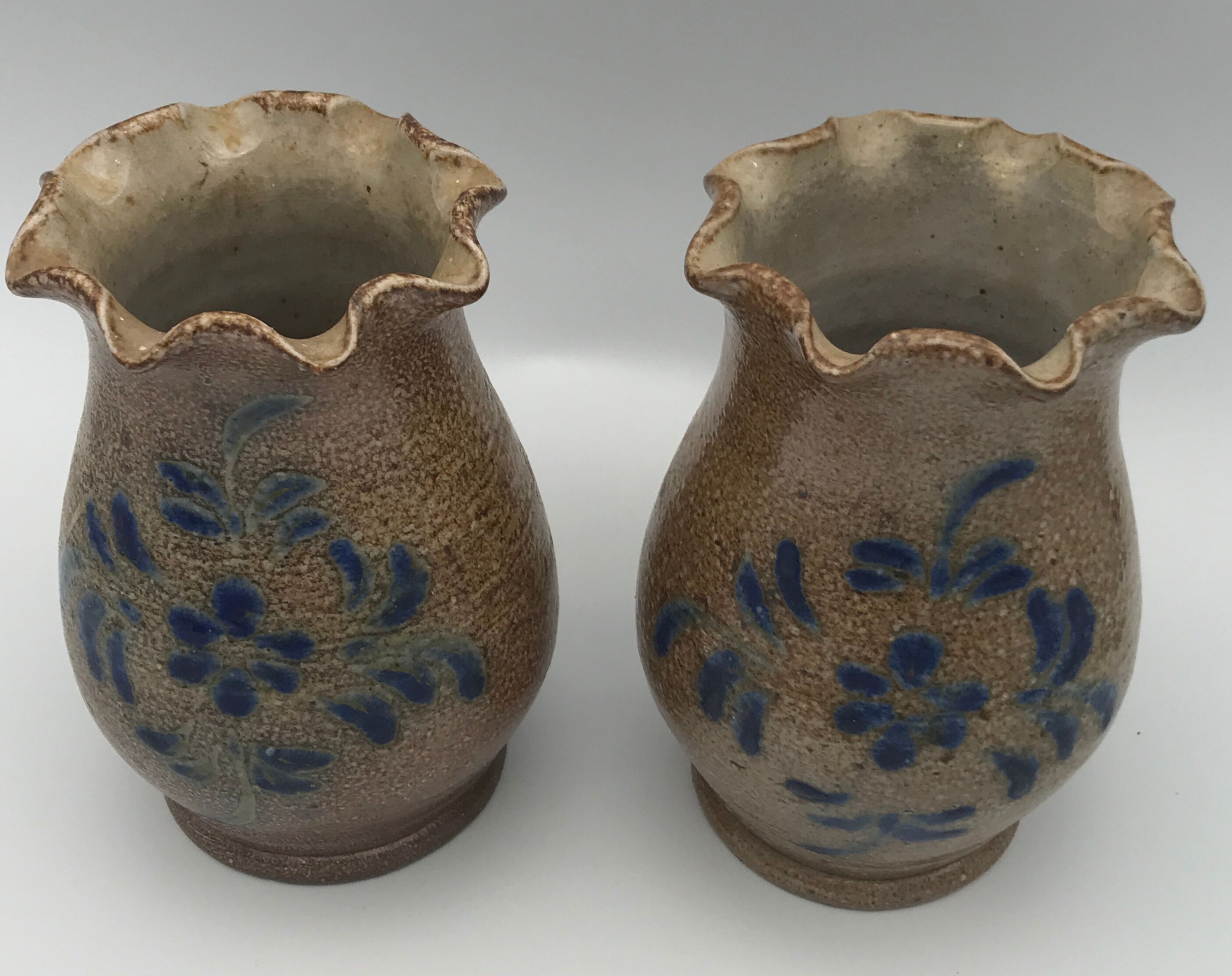 Pair of vintage pottery vases with floral decoration and glaçureau sel