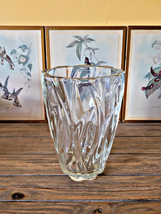 Vintage thick glass vase with twisted ribbed relief.