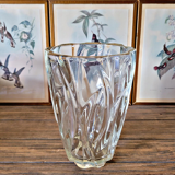 Vintage thick glass vase with twisted ribbed relief.