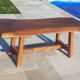 Rustic handcrafted coffee table with a mahogany top and elm legs.