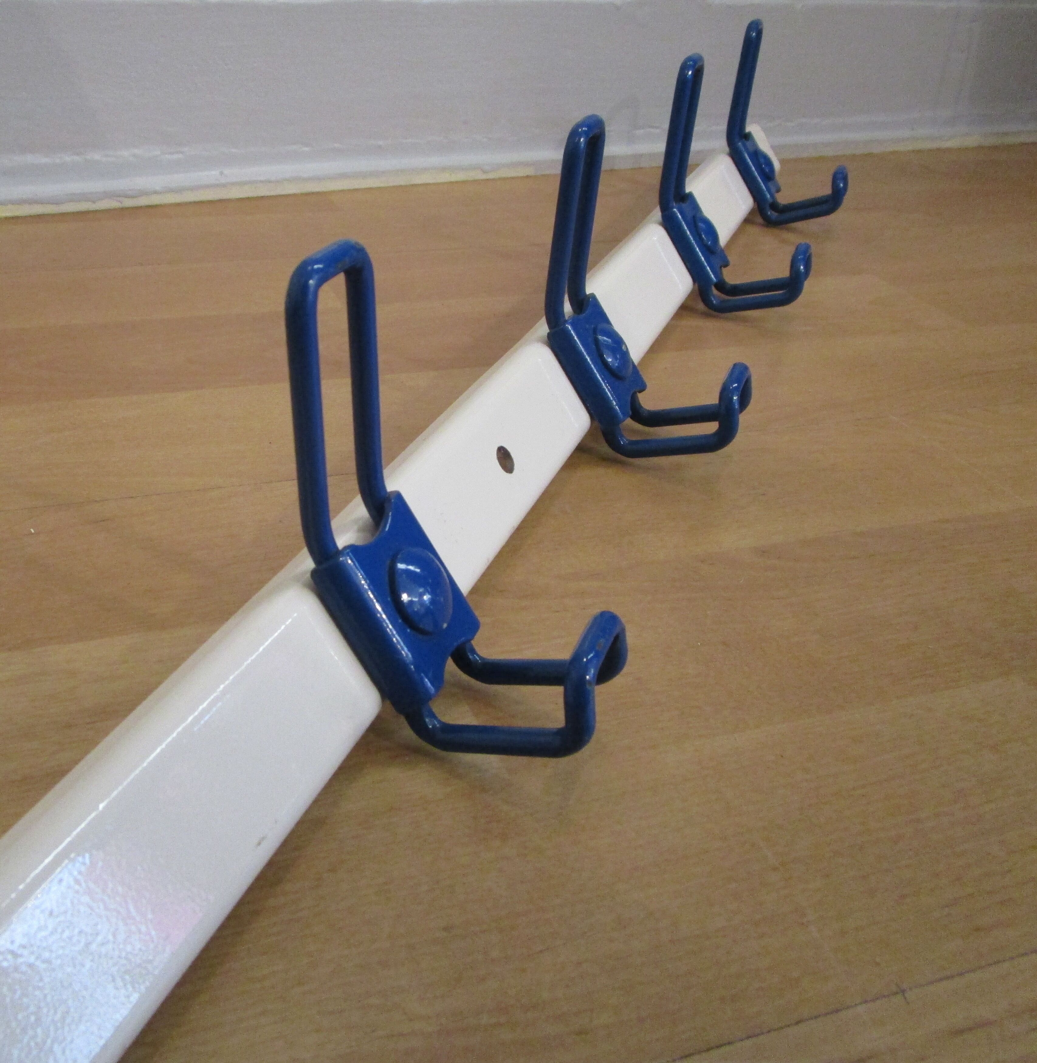 White and blue lacquered steel wall coat holder