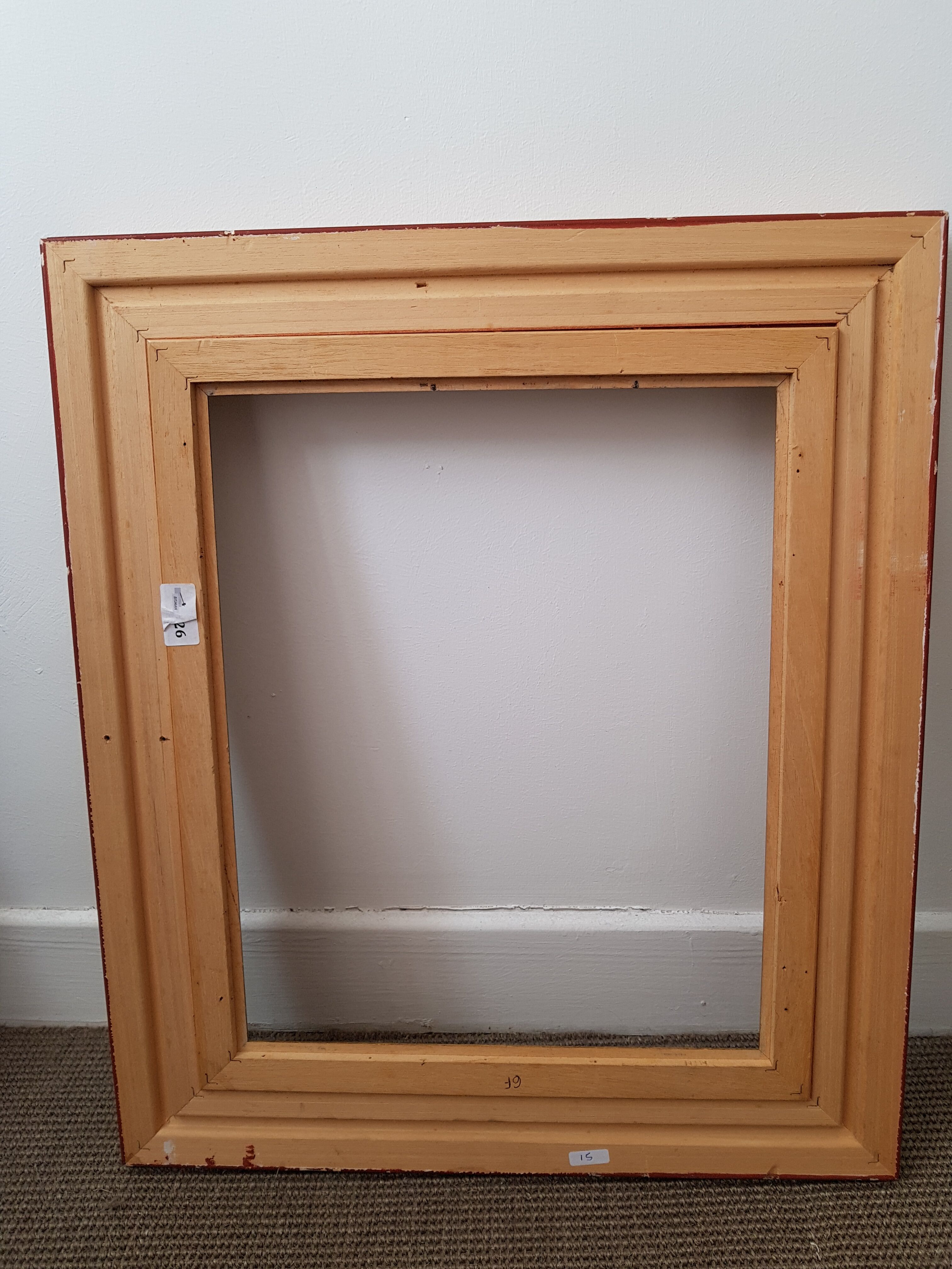 Framed black gilded wood and cream fabric