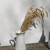 Old white enamelled metal pitcher