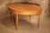 Oval light oak table with extension