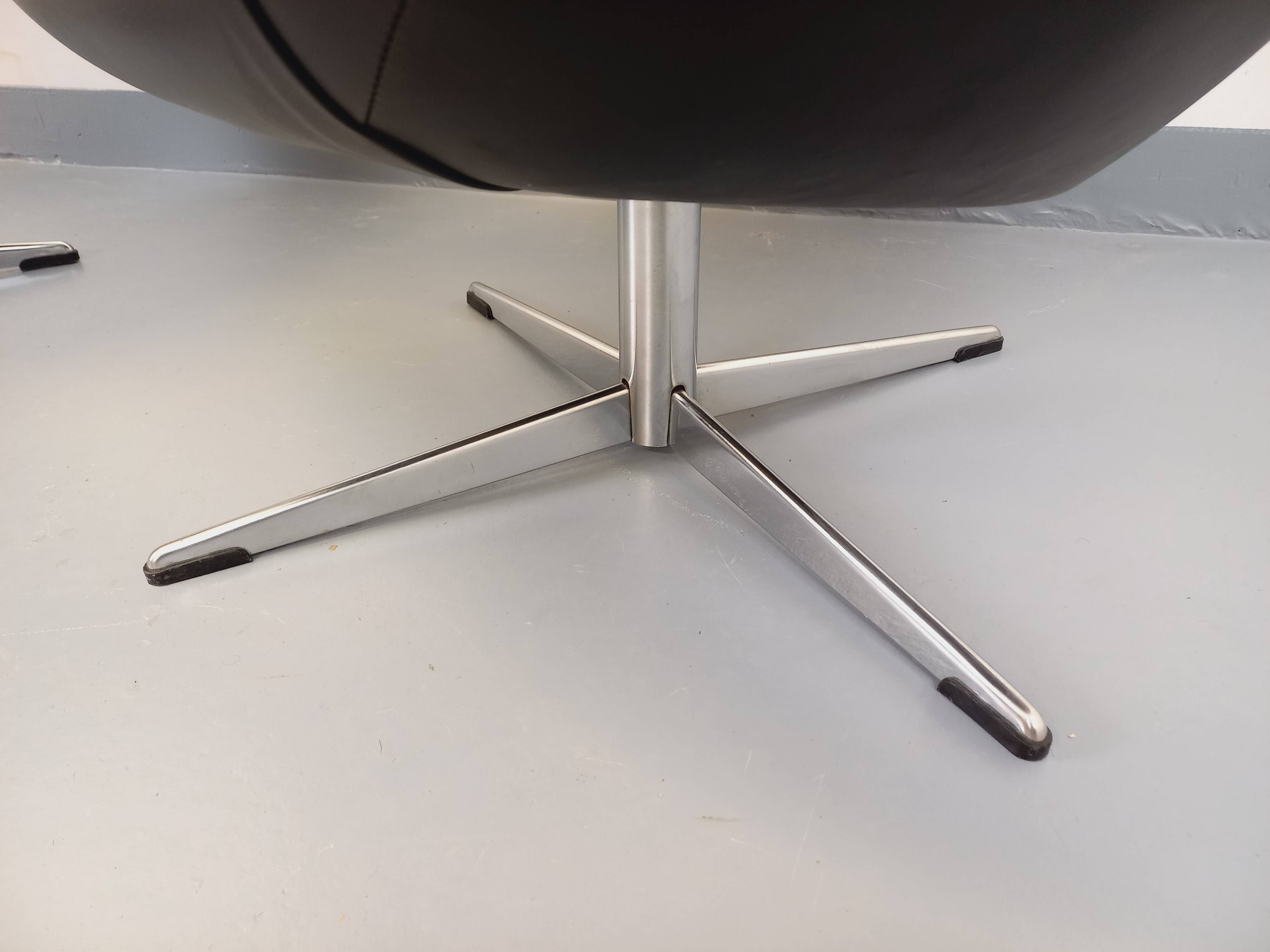 Pair of vintage Scandinavian swivel armchairs in faux leather and chrome.