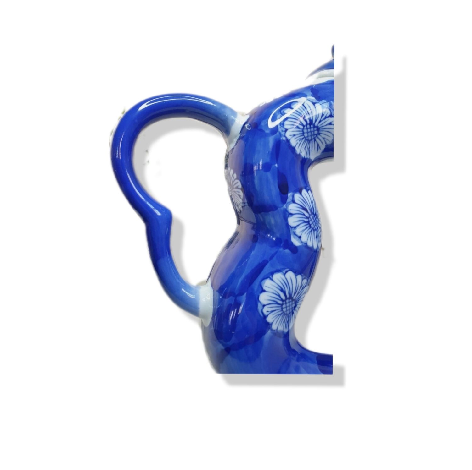 Old Asian teapot in toroidal shape in blue porcelain with floral decoration 20th century