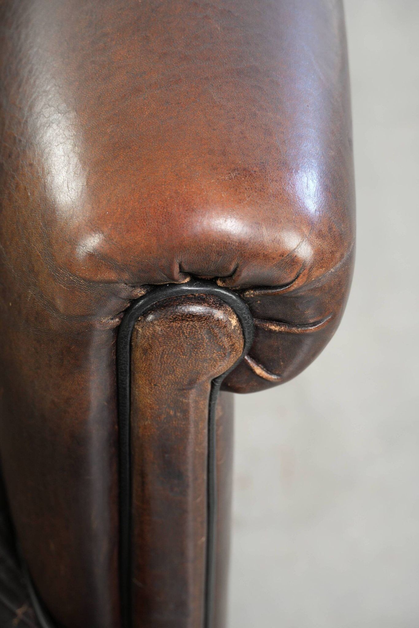 Dark sheepskin club armchair with unique design in English style