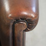 Dark sheepskin club armchair with unique design in English style