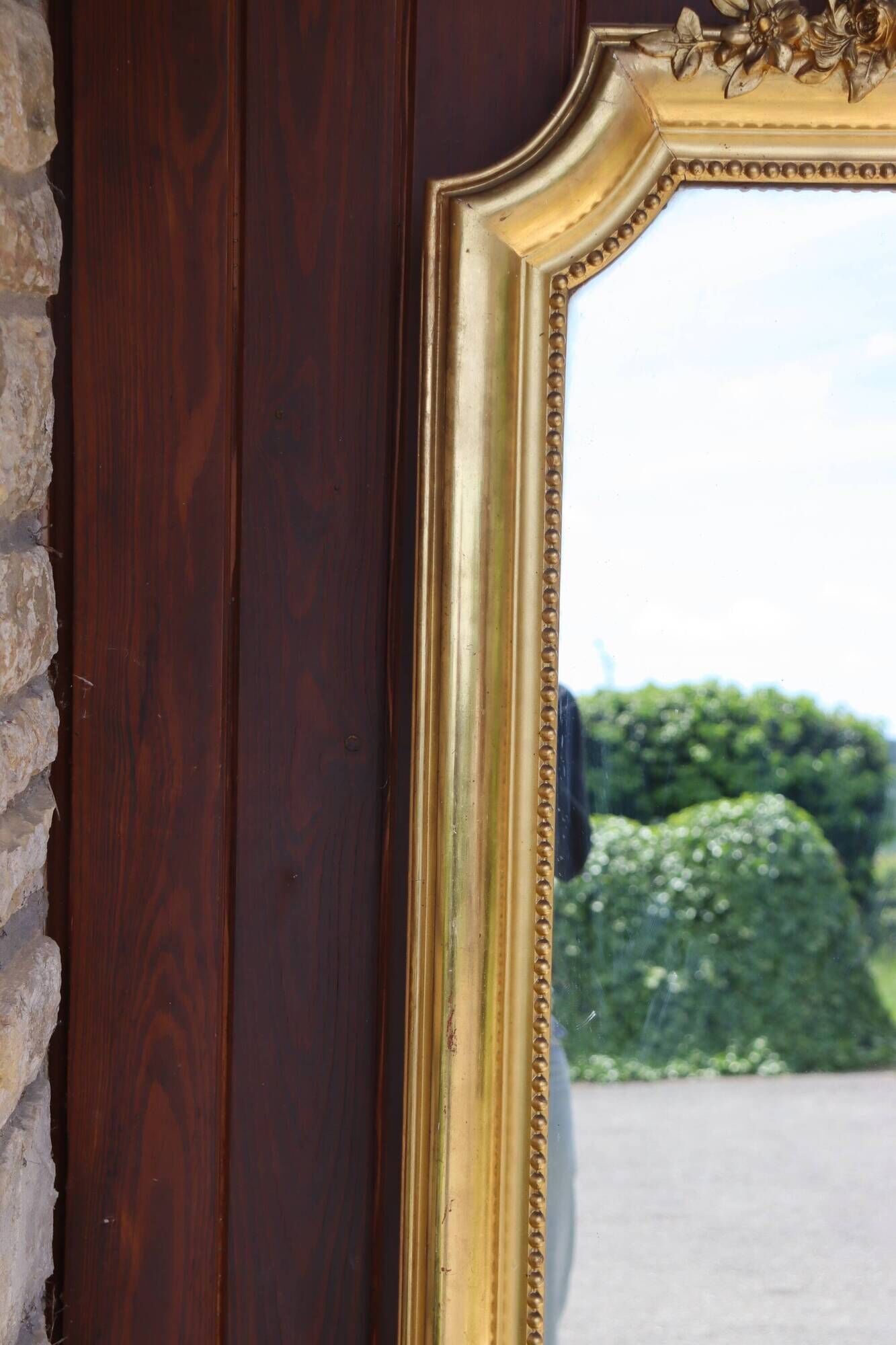 Large gold mirror in Louis XV style