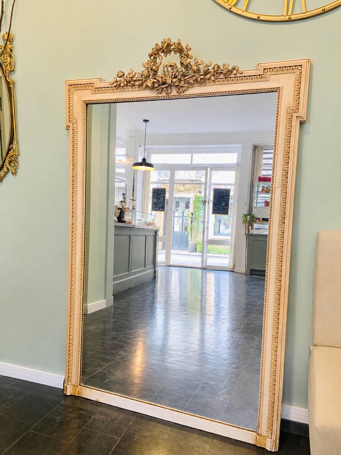 large antique mirror with richly carved pediment in Louis XV / Napoleon style