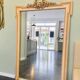 large antique mirror with richly carved pediment in Louis XV / Napoleon style