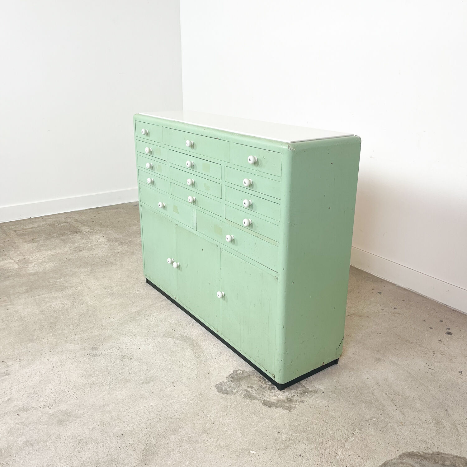 Vintage mint green dentist drawer unit with opaline glass top