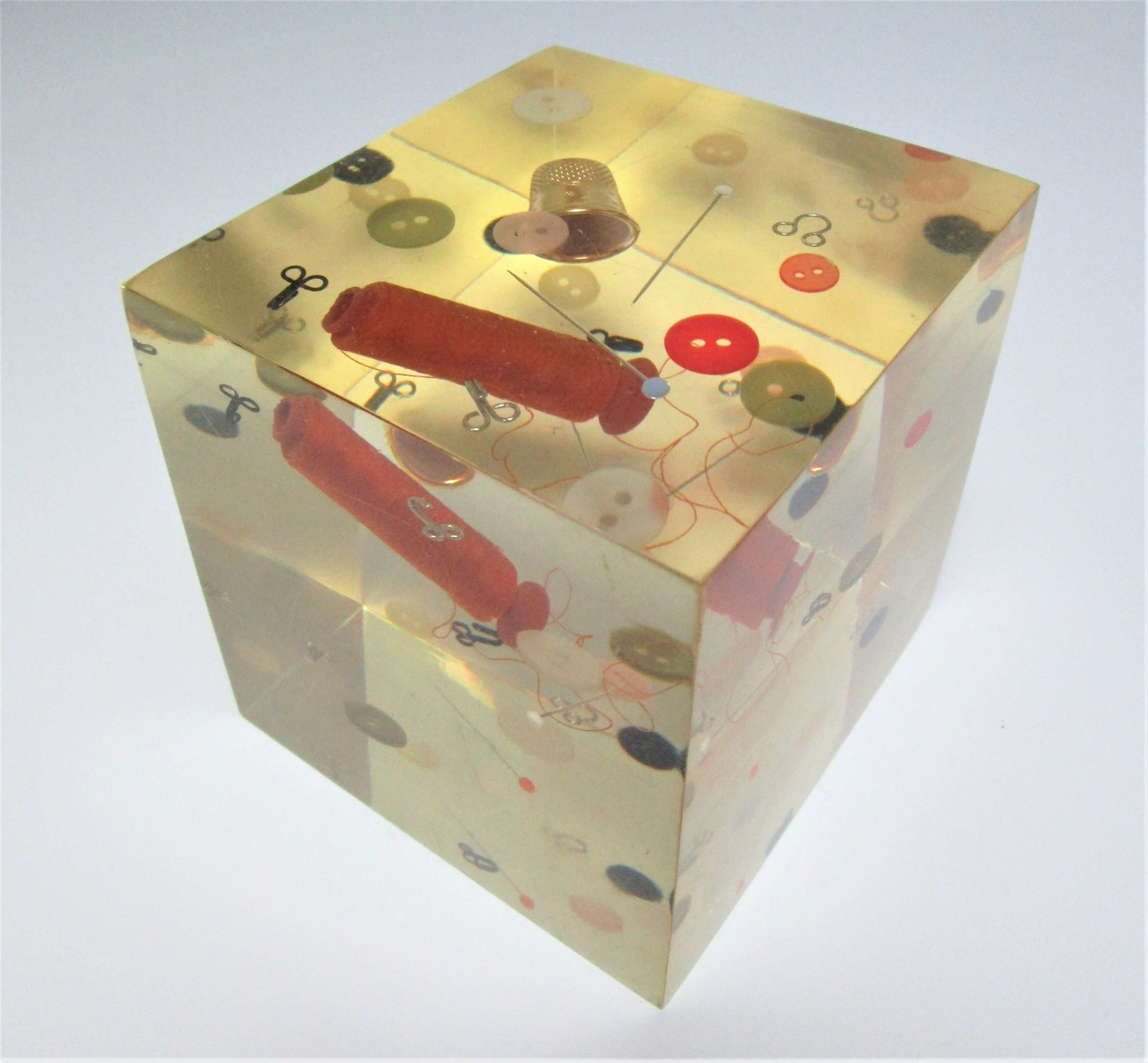 Paperweight sculpture block resin inclusions sewing design 70s
