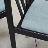Set of 4 modernist black chairs with light blue ribbed fabric
