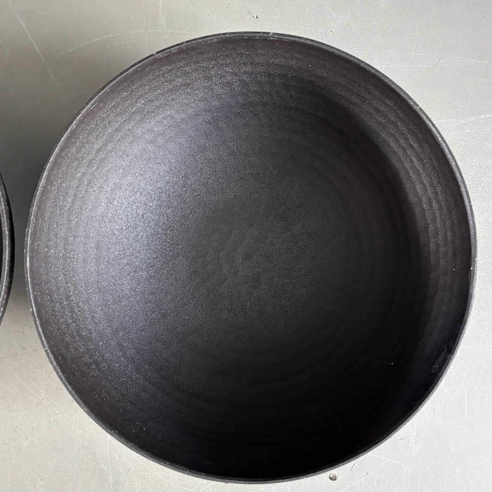 Pair of black lacquered metal catchall bowls