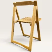Blonde wooden folding chair in the style of Aldo Jacober.