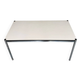 USM Haller design desk or table with a white top and metal structure.