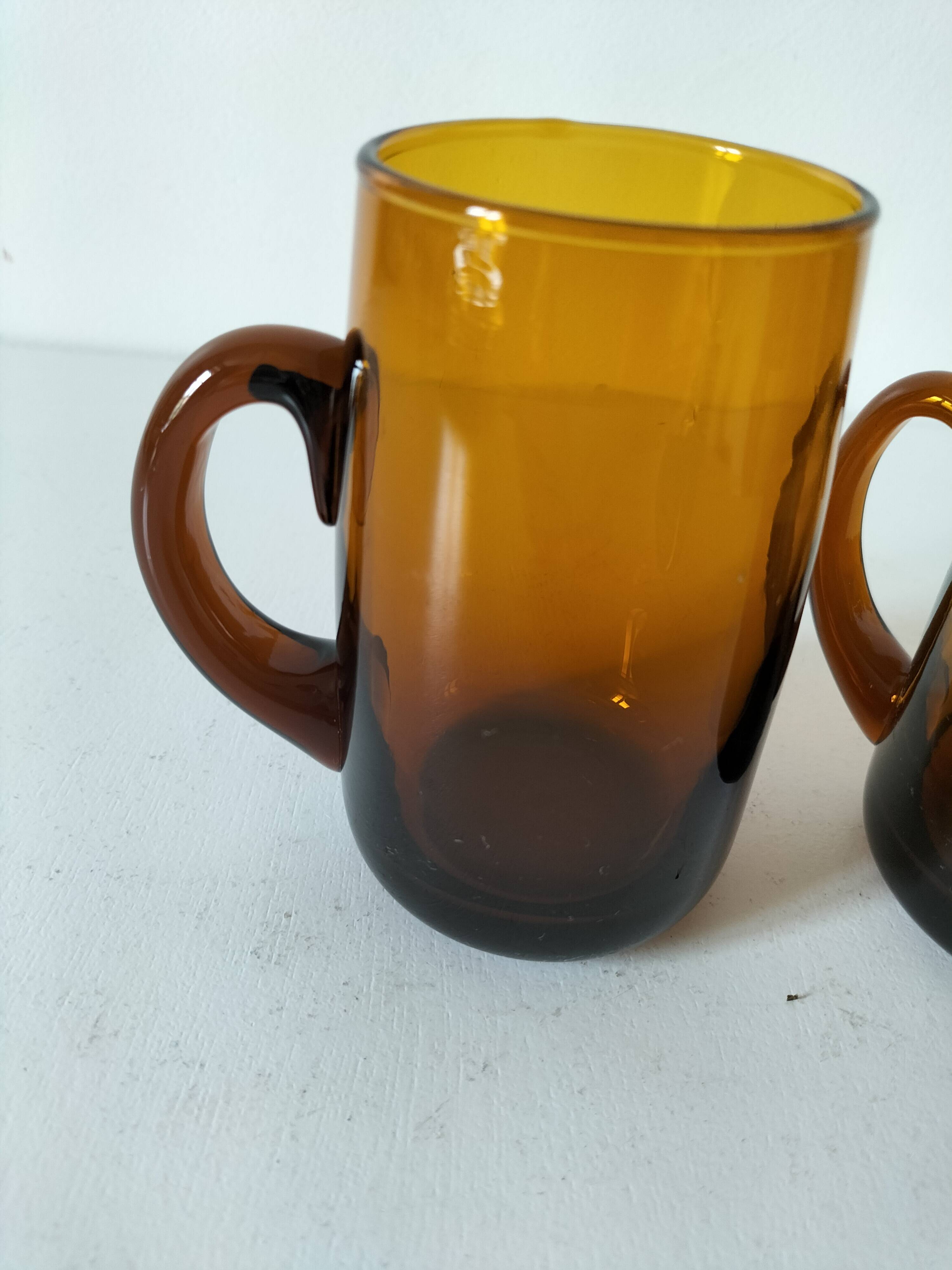 Pair of vintage amber glass tankards
