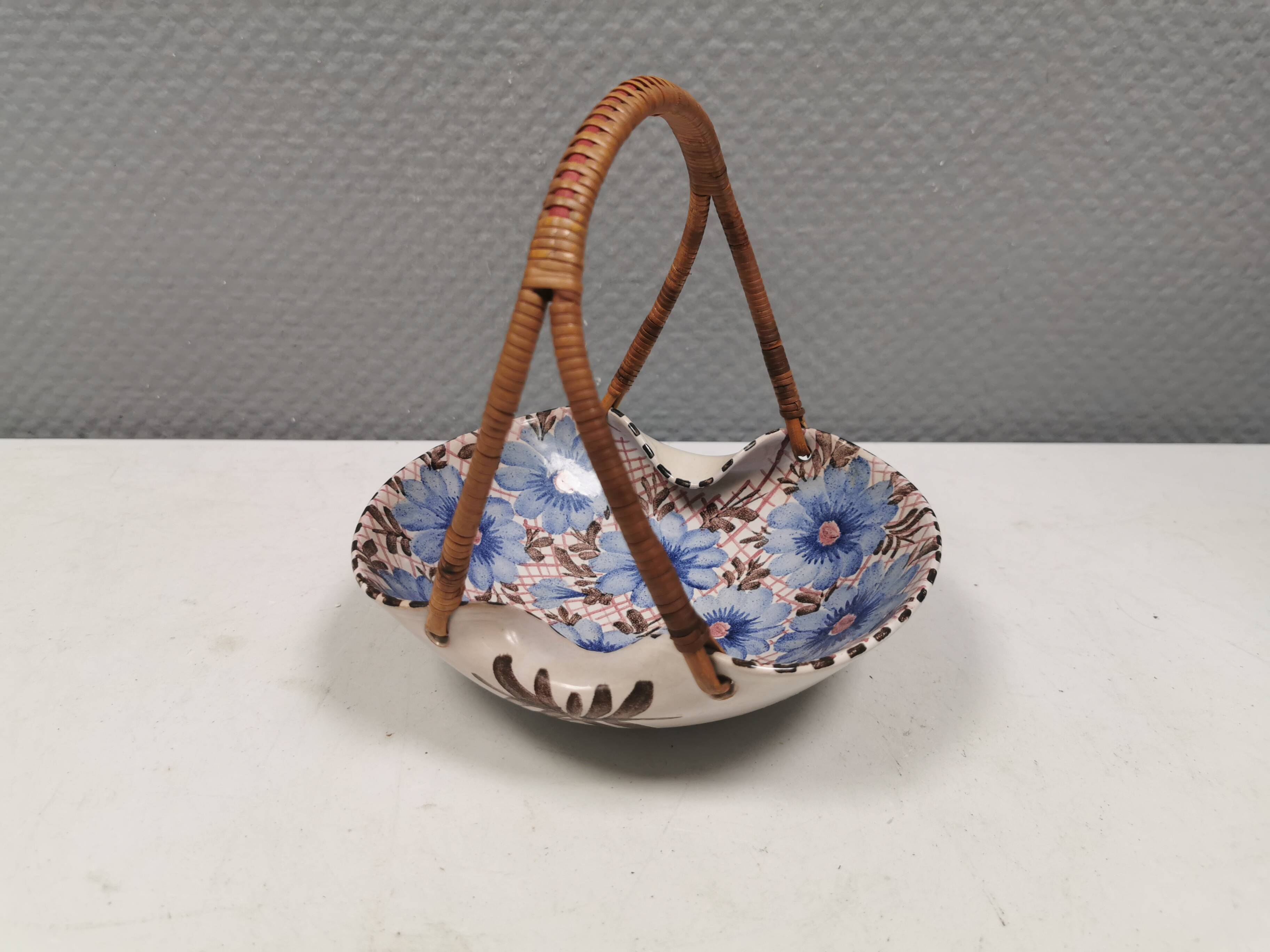 Beautiful small painted ceramic basket with woven handle