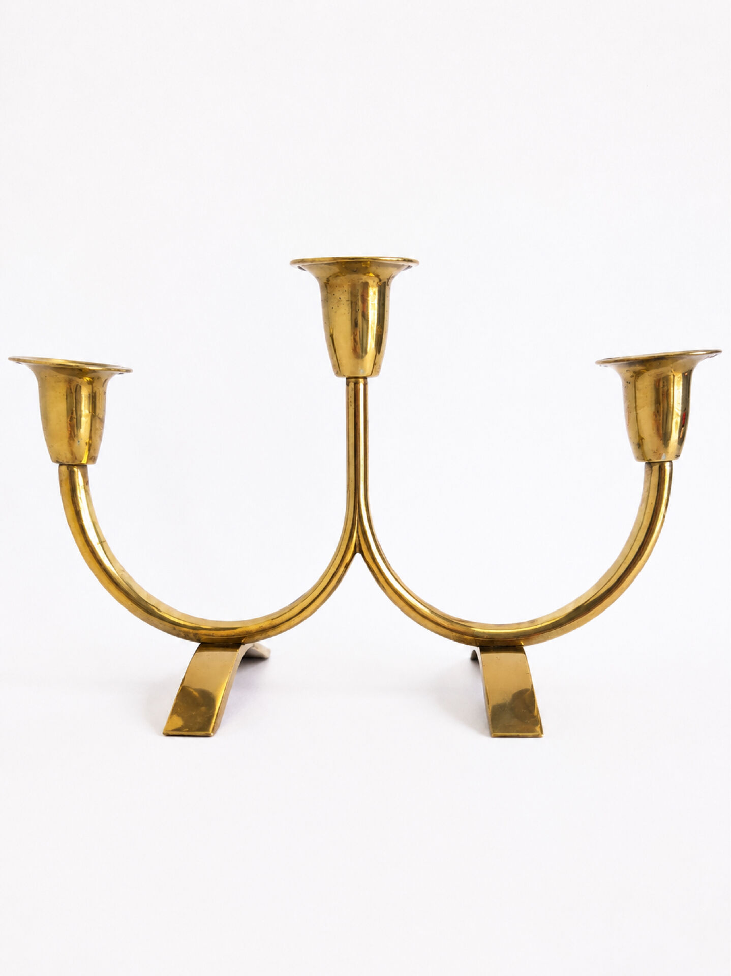 Candelabrum in brass attributed to Gunnar Ander, Ystad, Sweden, mid-20th century.
