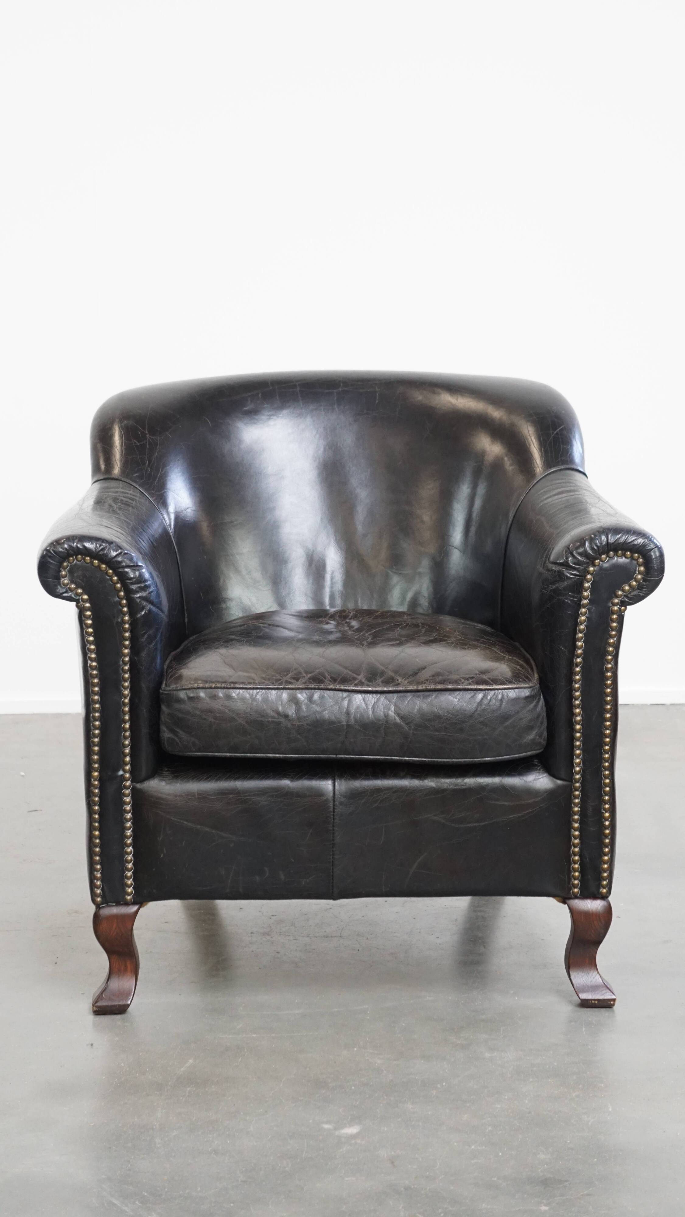 Black cowhide leather armchair