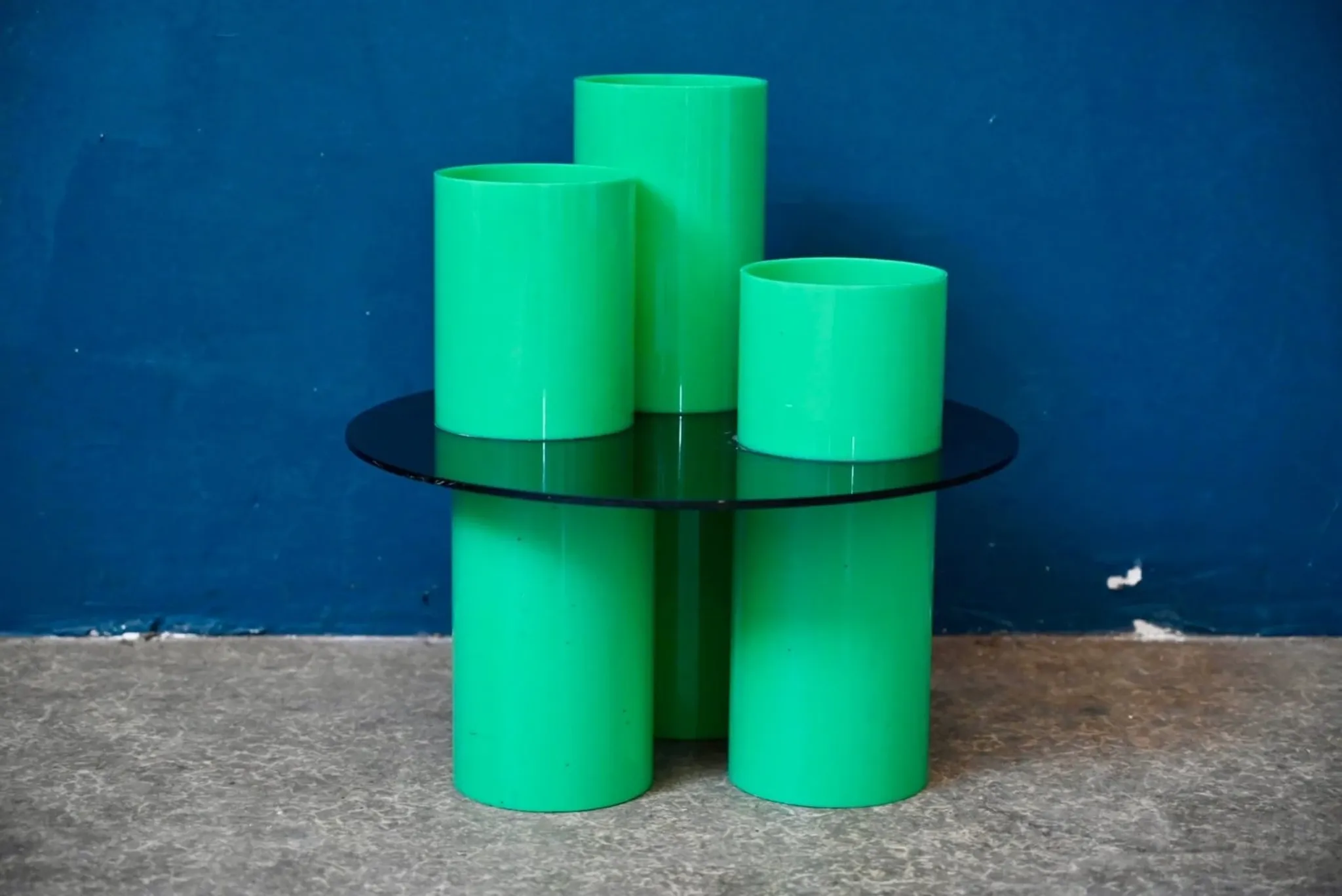 Green plexiglass coffee table in Memphis design style from the 1980s.
