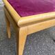 Adjustable piano stool in light beech and purple velvet.