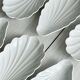 Set of white porcelain ramekins, ribbed shell shape.