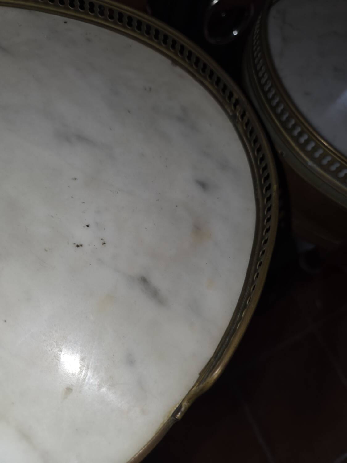 Pair of Louis XVI style bedside tables in mahogany, with marble tops.