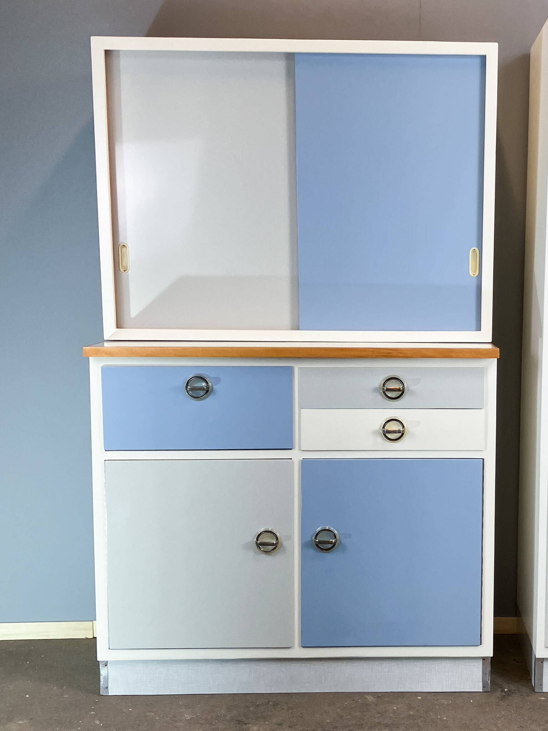 Kitchen cabinets, pastel blue and light gray, vintage from the 60s