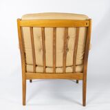 Armchair in dark wood and upholstered with light elegance leather of danish design, 1960s