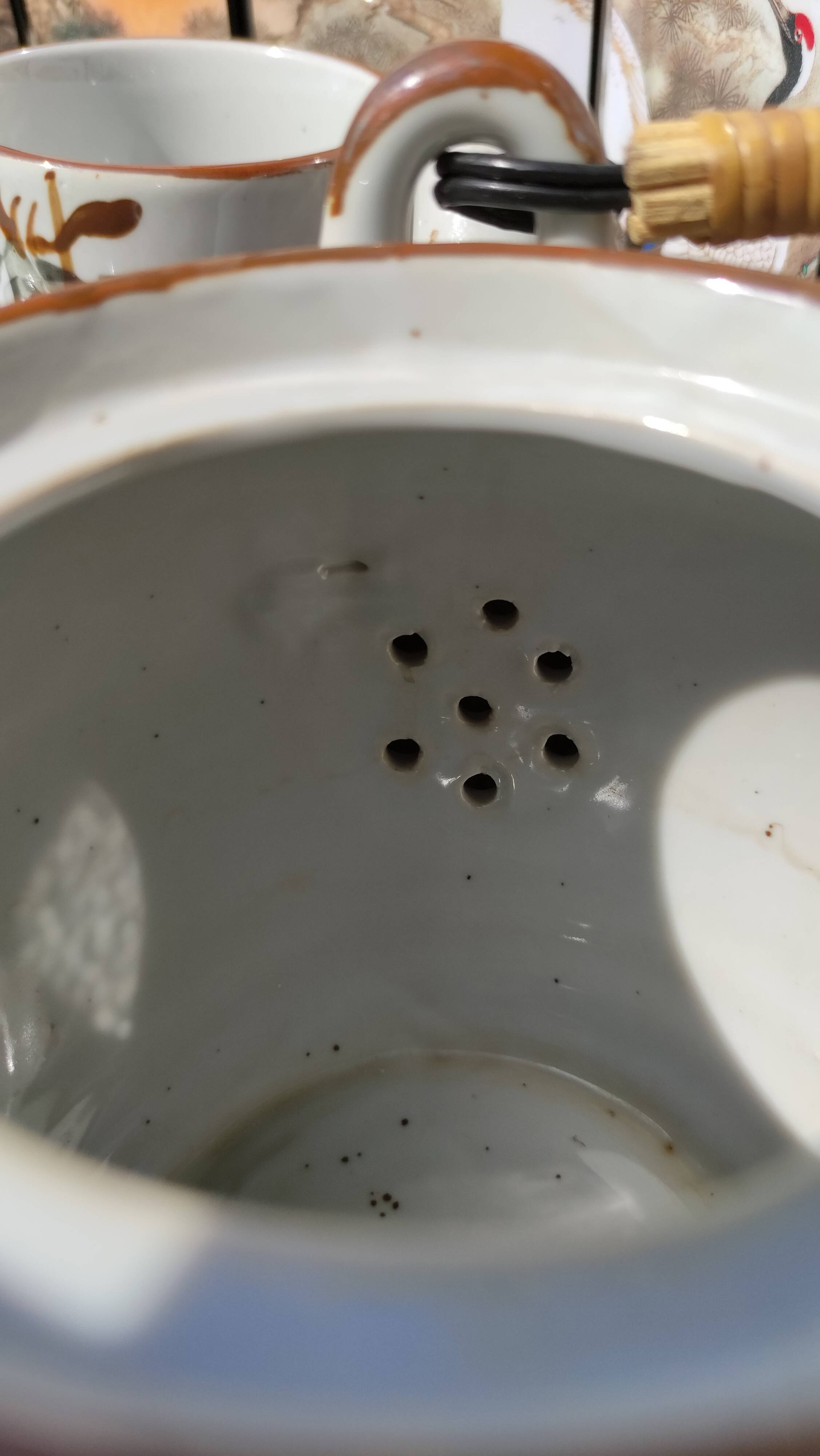 Asian set of a teapot and its cups