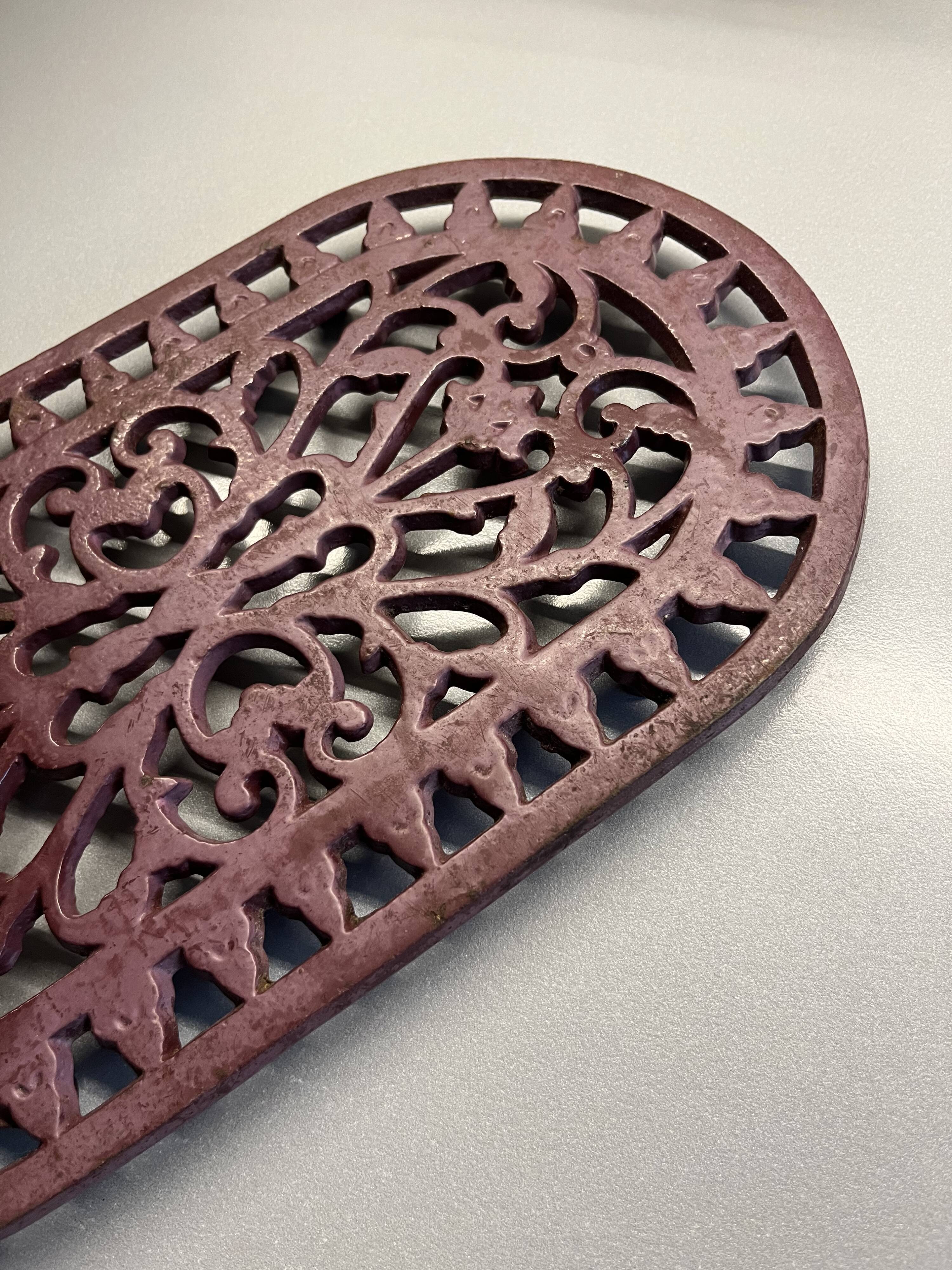 Old cast iron table mat