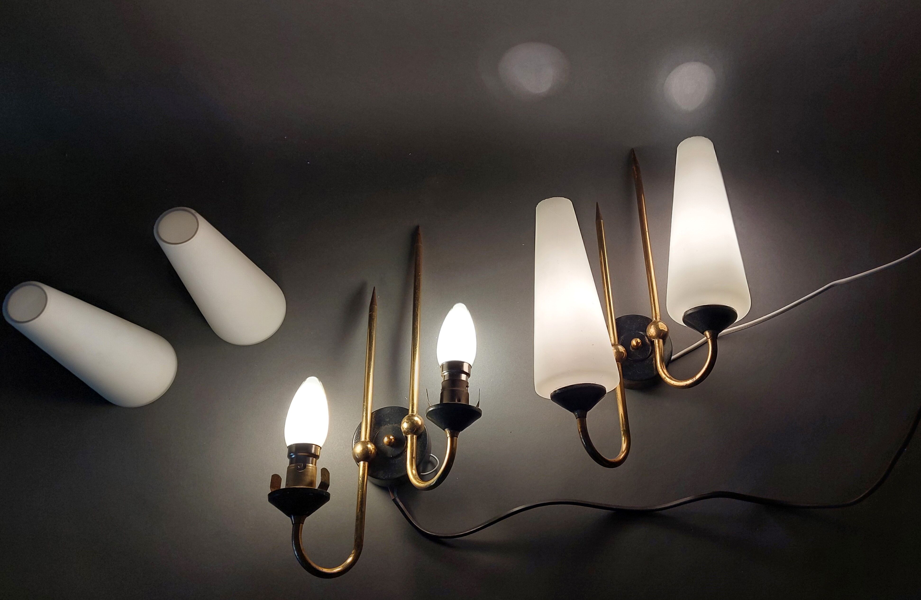Pair of sconces in black metal and gilded brass 1960 Vintage.