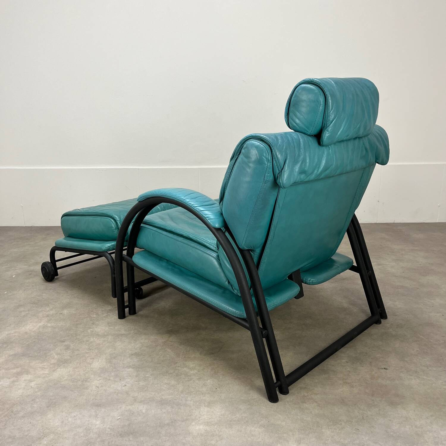 Postmodern design armchair and ottoman, 80s leather