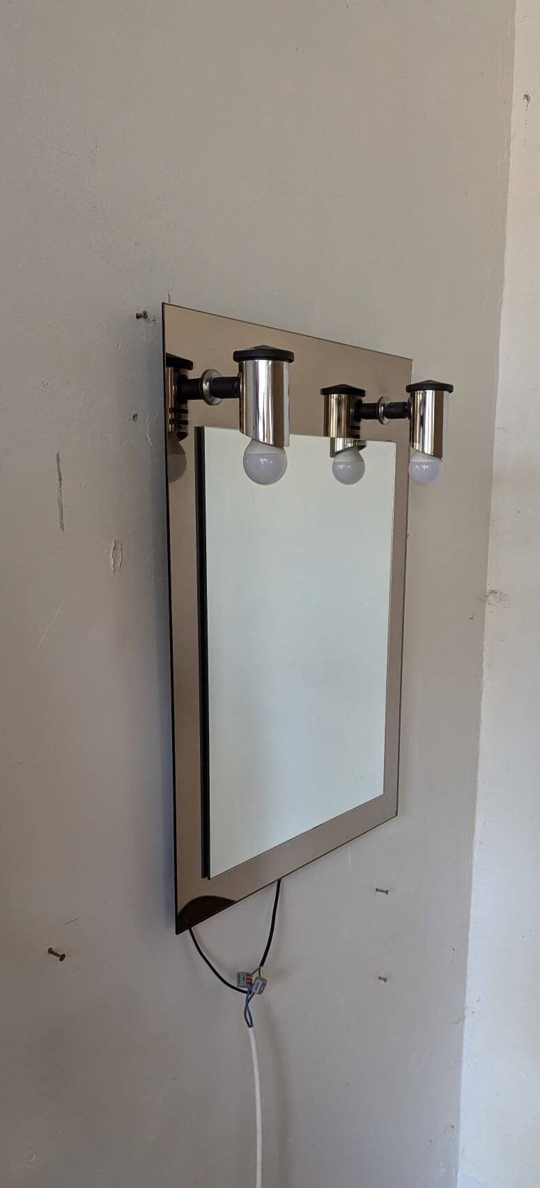 Vintage mirror with sconces.