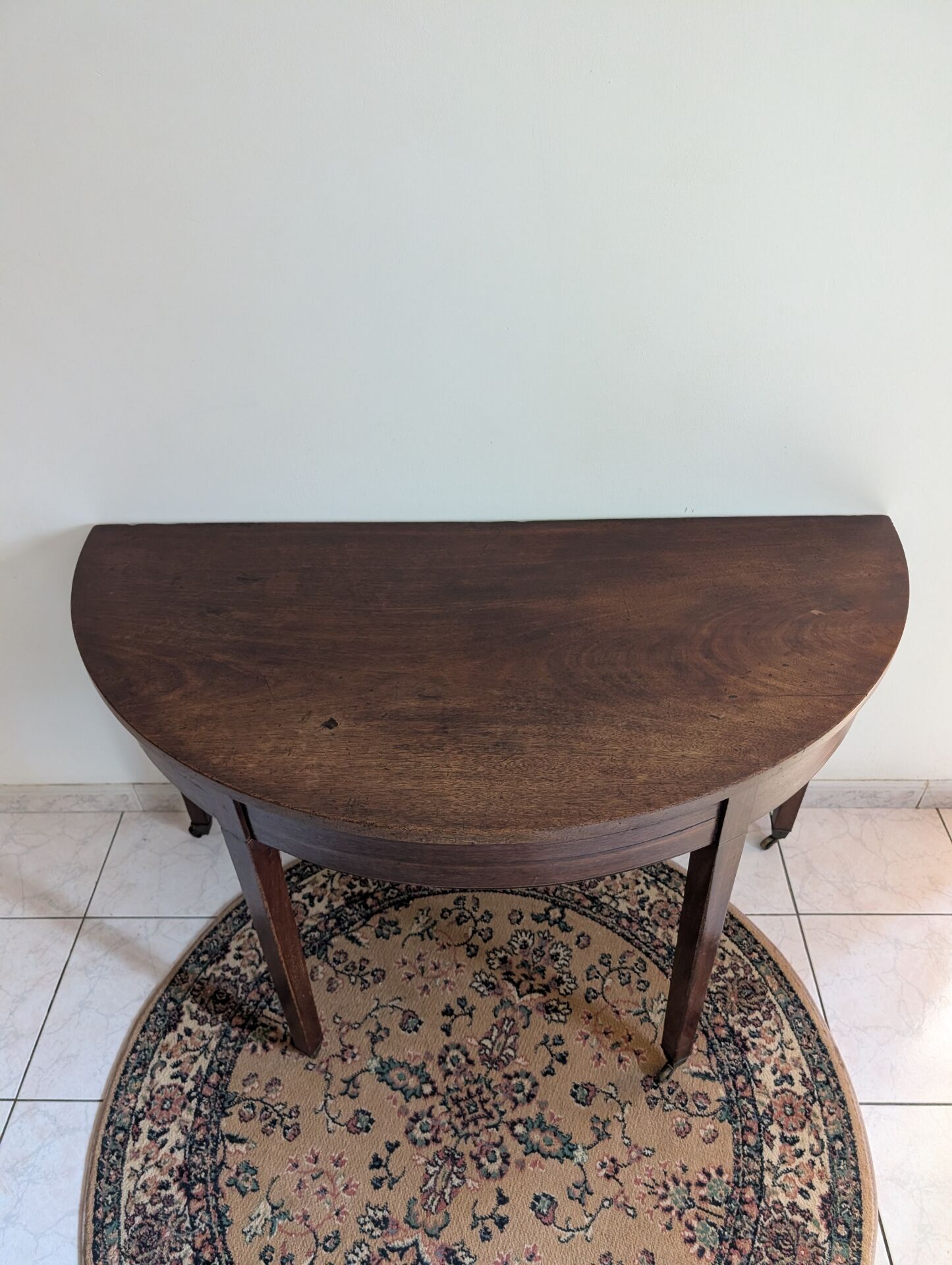 Old half-moon table or serving trolley on wheels
