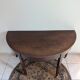Old half-moon table or serving trolley on wheels