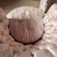 Pair of Hollywood Regency style cabriolet armchairs in satin pink, 1970s.
