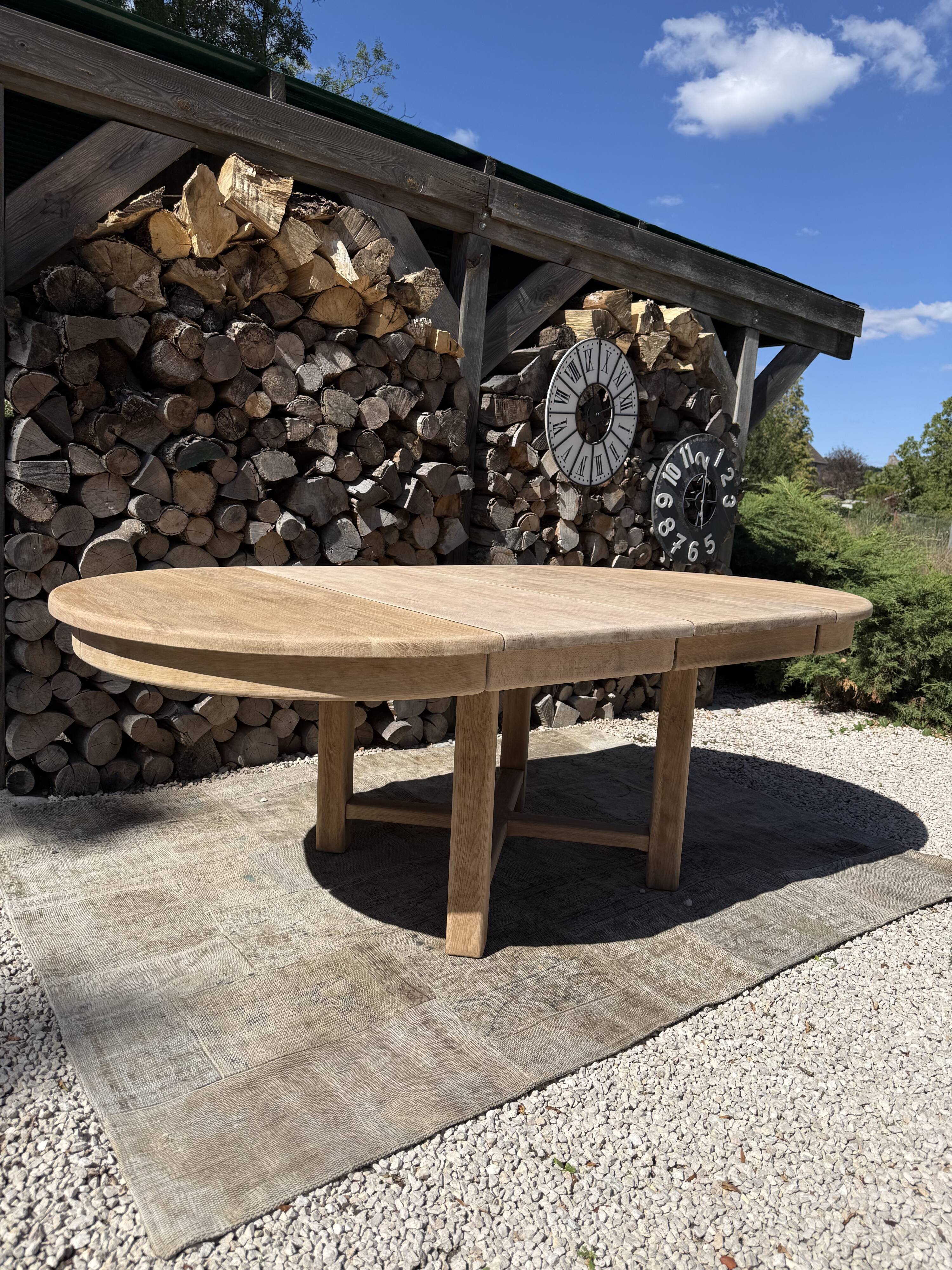 Round solid oak table with extensions, maximum 220cm.
