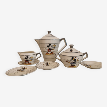 “Mickey Mouse” earthenware tea service including a teapot, a milk jug, a sugar pot