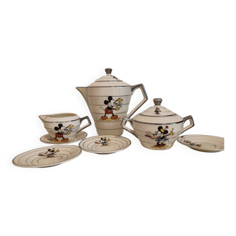 “Mickey Mouse” earthenware tea service including a teapot, a milk jug, a sugar pot