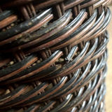 High basket in braided wicker