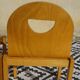 Pair of light wood chairs with post-formed seat and backrest.