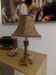 Gold baroque style table lamp with a shade adorned with pendants.