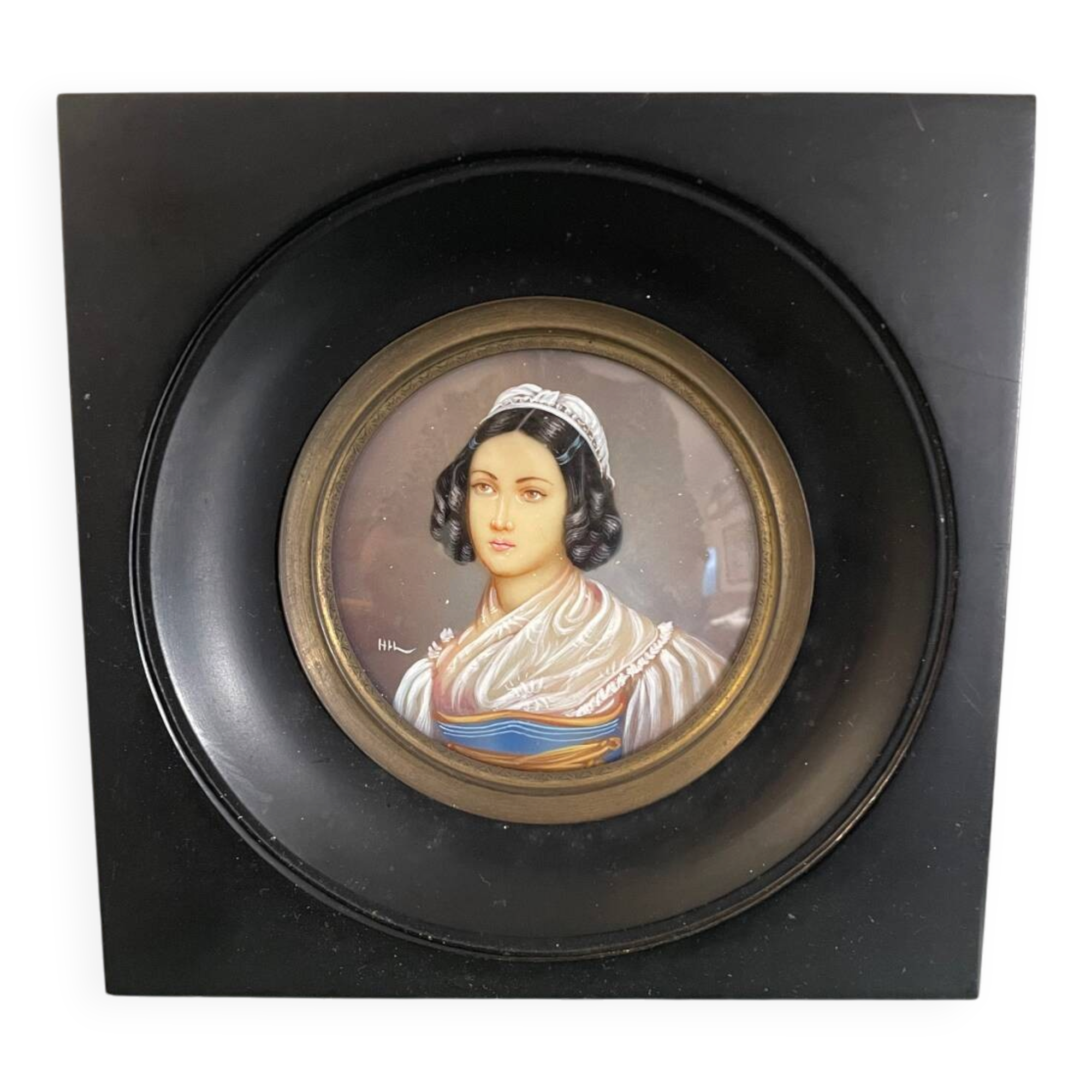 Old miniature portrait painting of a woman.