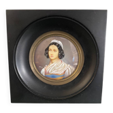 Old miniature portrait painting of a woman.