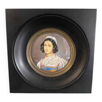 Old miniature portrait painting of a woman.
