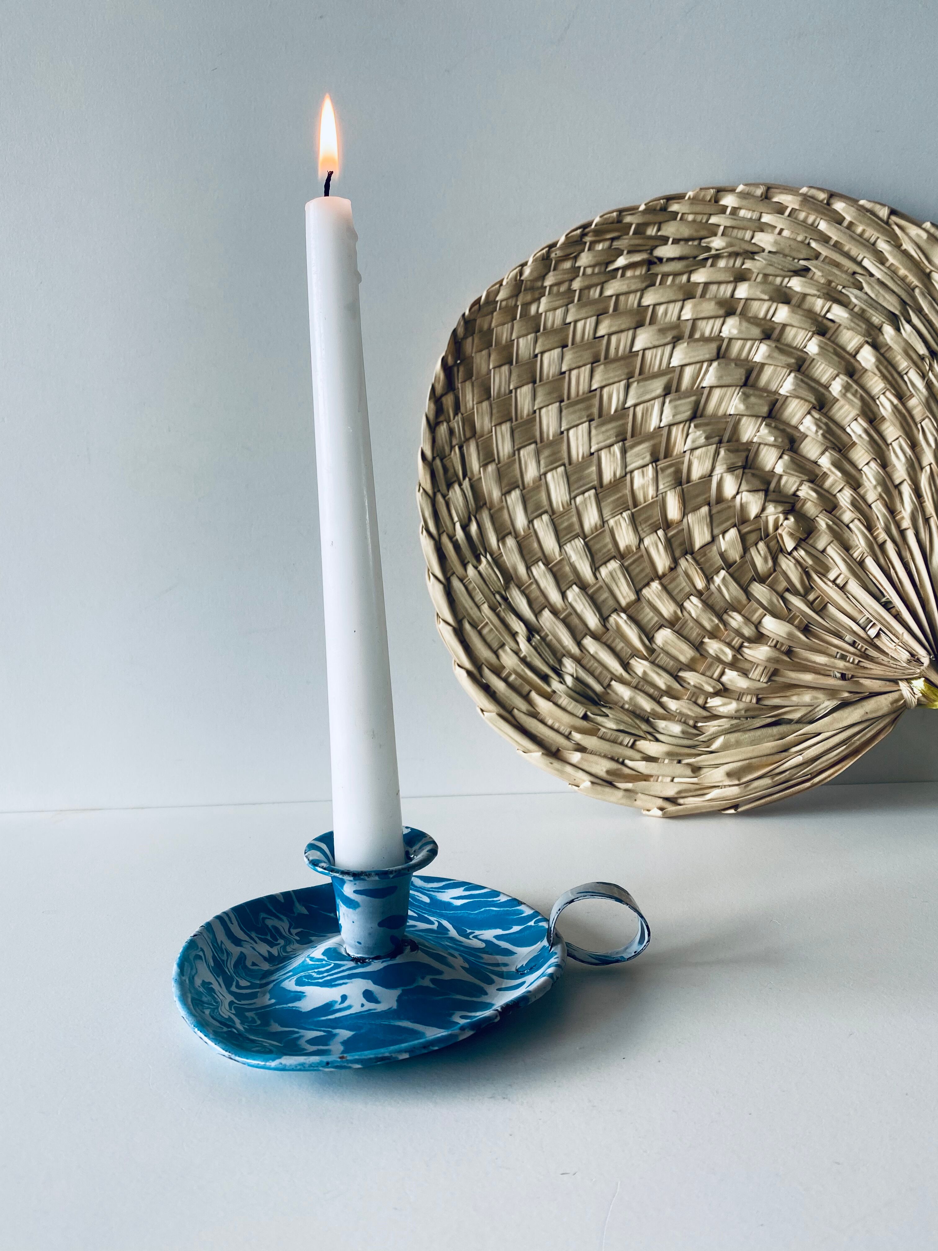 Old enamelled metal candlestick