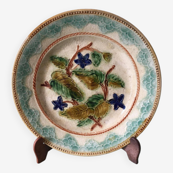 Old barbotine dessert plate. Floral patterns